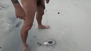 Mature man dedicating his golden shower on the nude beach