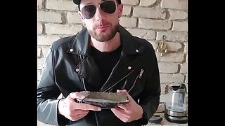 Leather guy cums on a plate