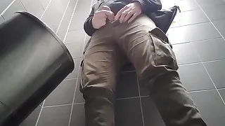 Young man with uncut dick peeing beside a public urinal. he then shows and shakes his dick.